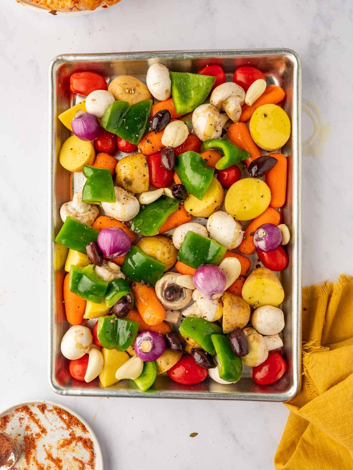 Vegetables arranged on a sheet pan.