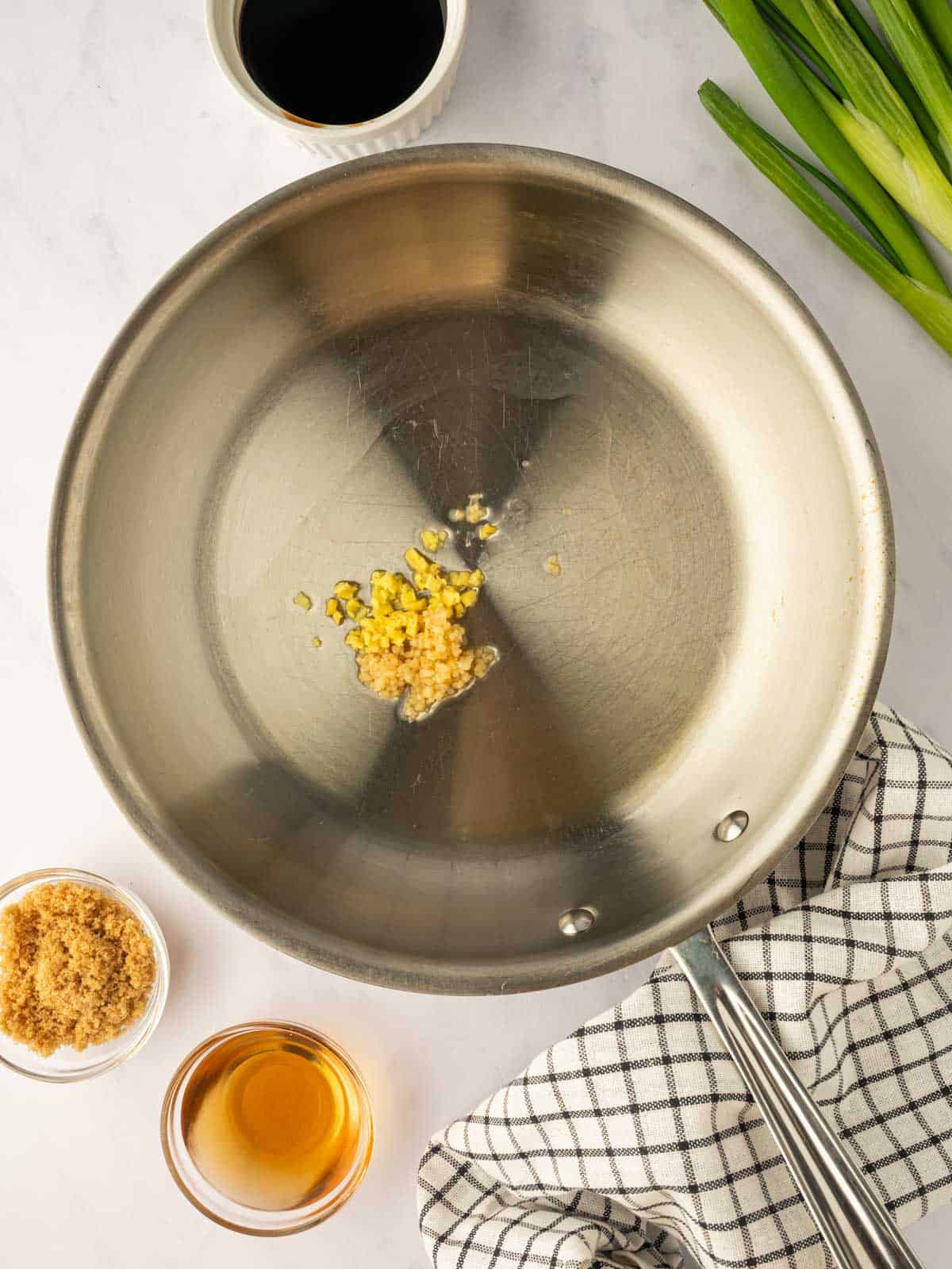 Saute garlic in a skillet.