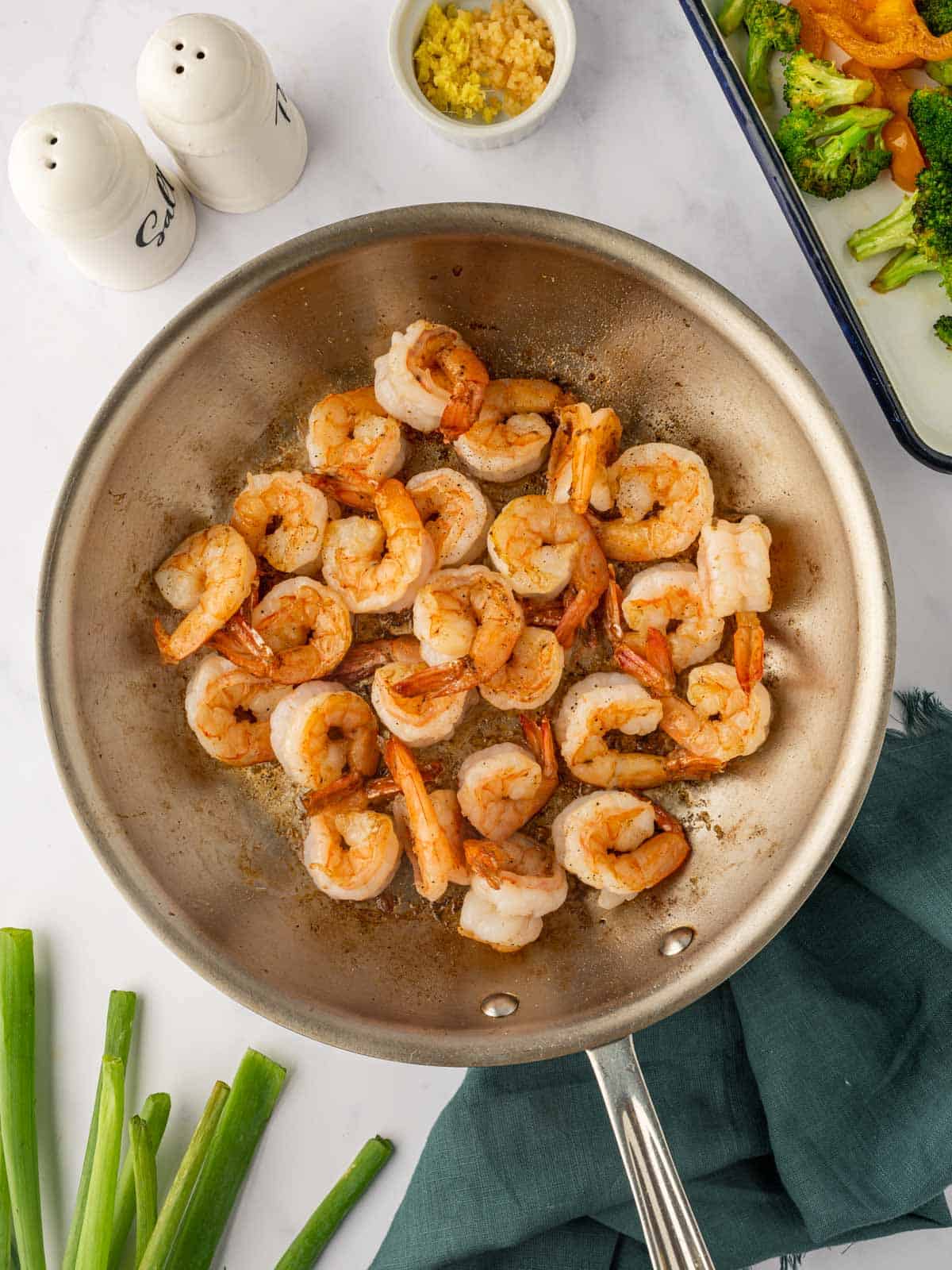 Saute shrimp in a skillet.