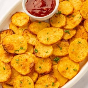 Crispy air fryer sliced potatoes on a platter.