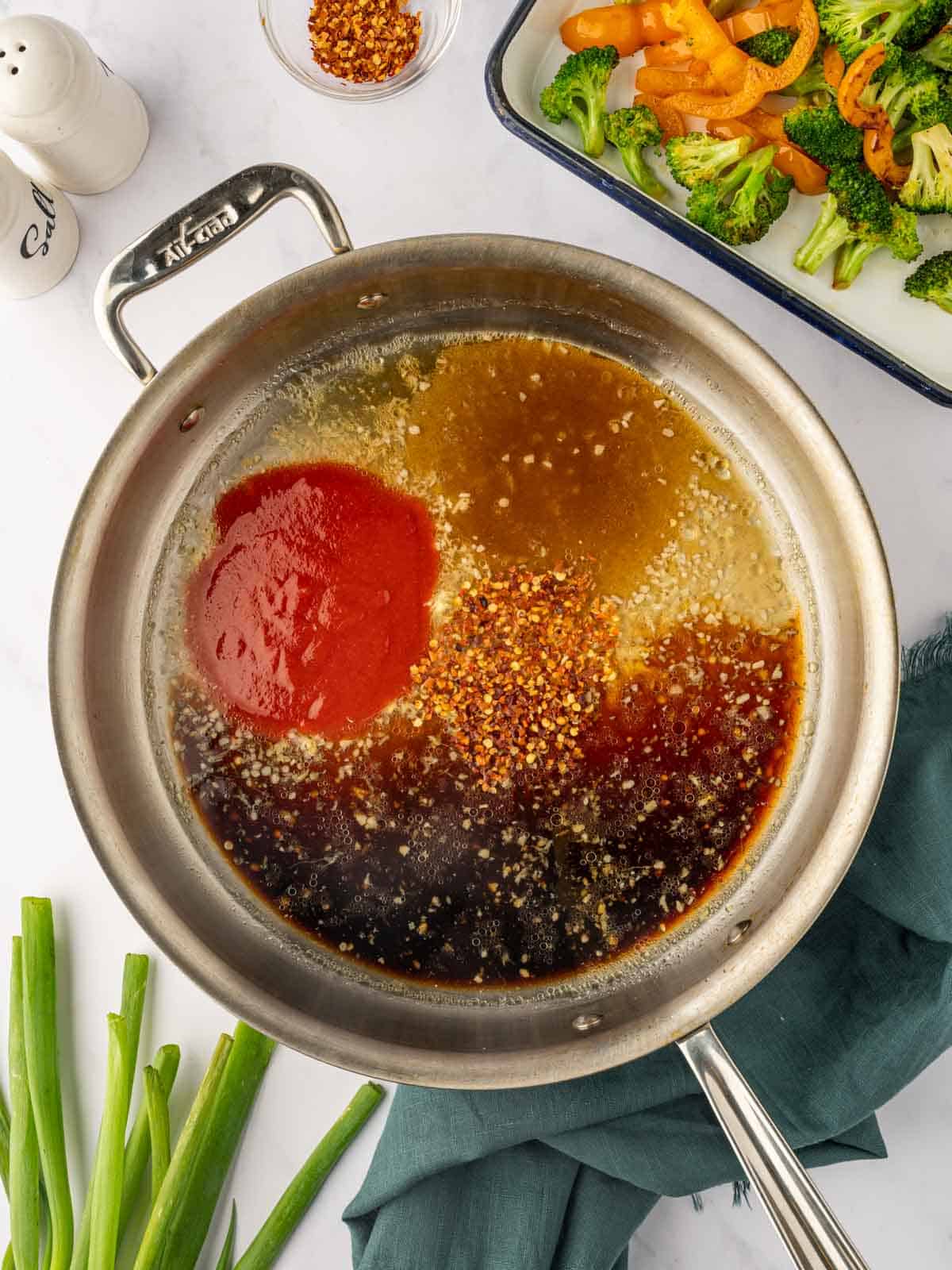 Ingredients for sweet chili sauce in a skillet.