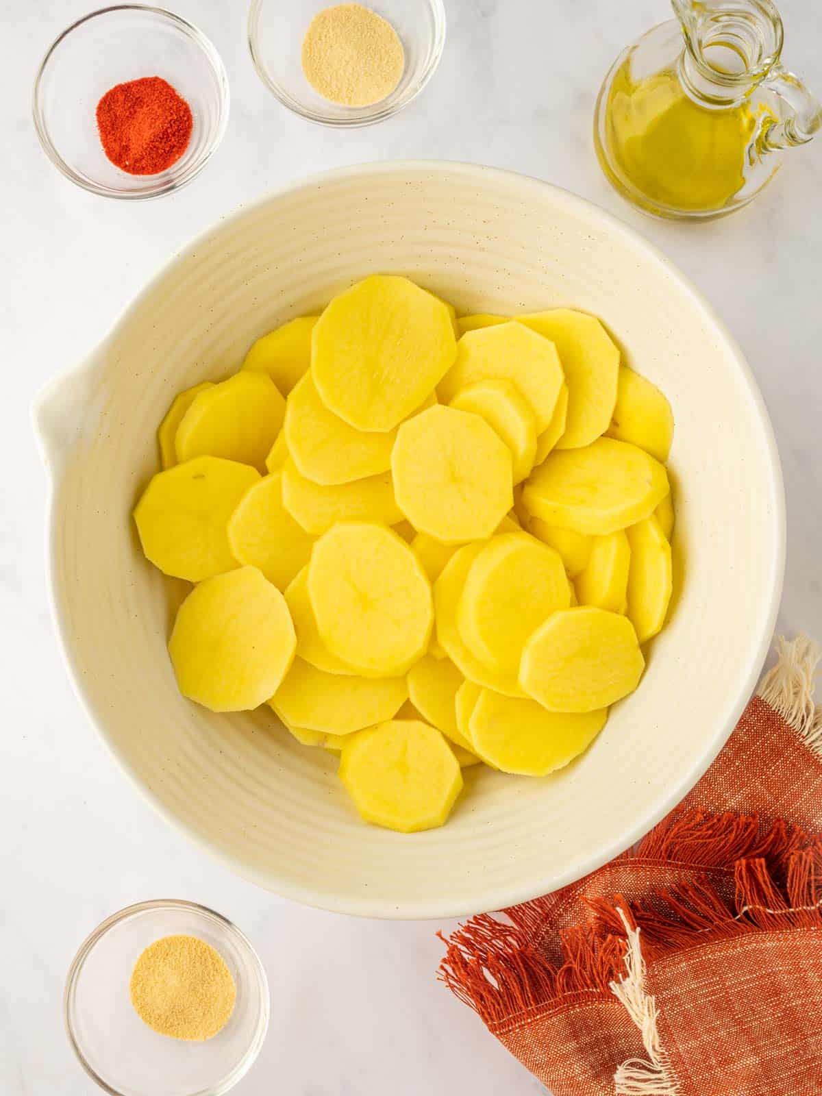 This slices of potato in a bowl.