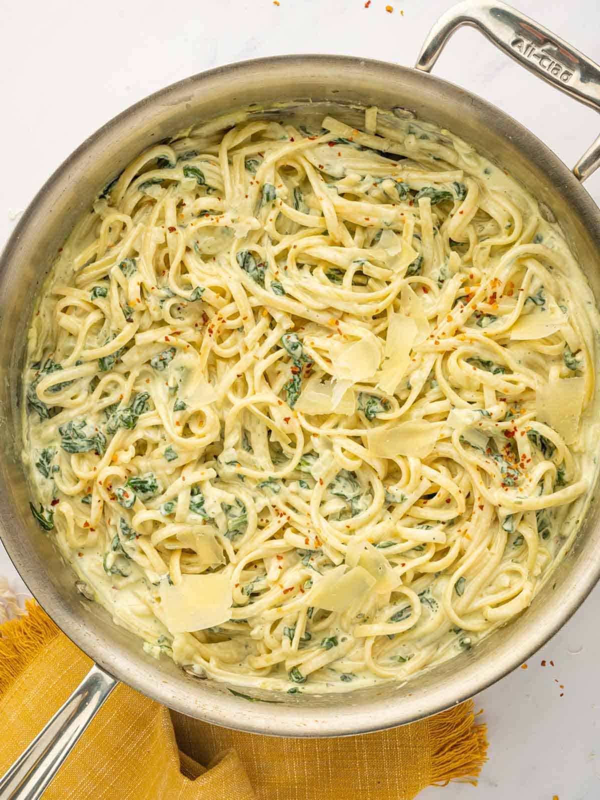 Cheesy pasta in a skillet.