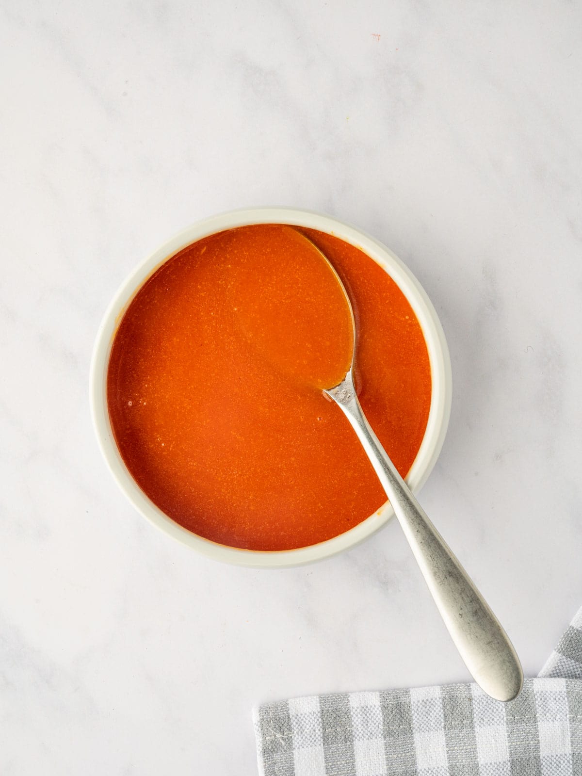 Homemade buffalo sauce in a bowl.