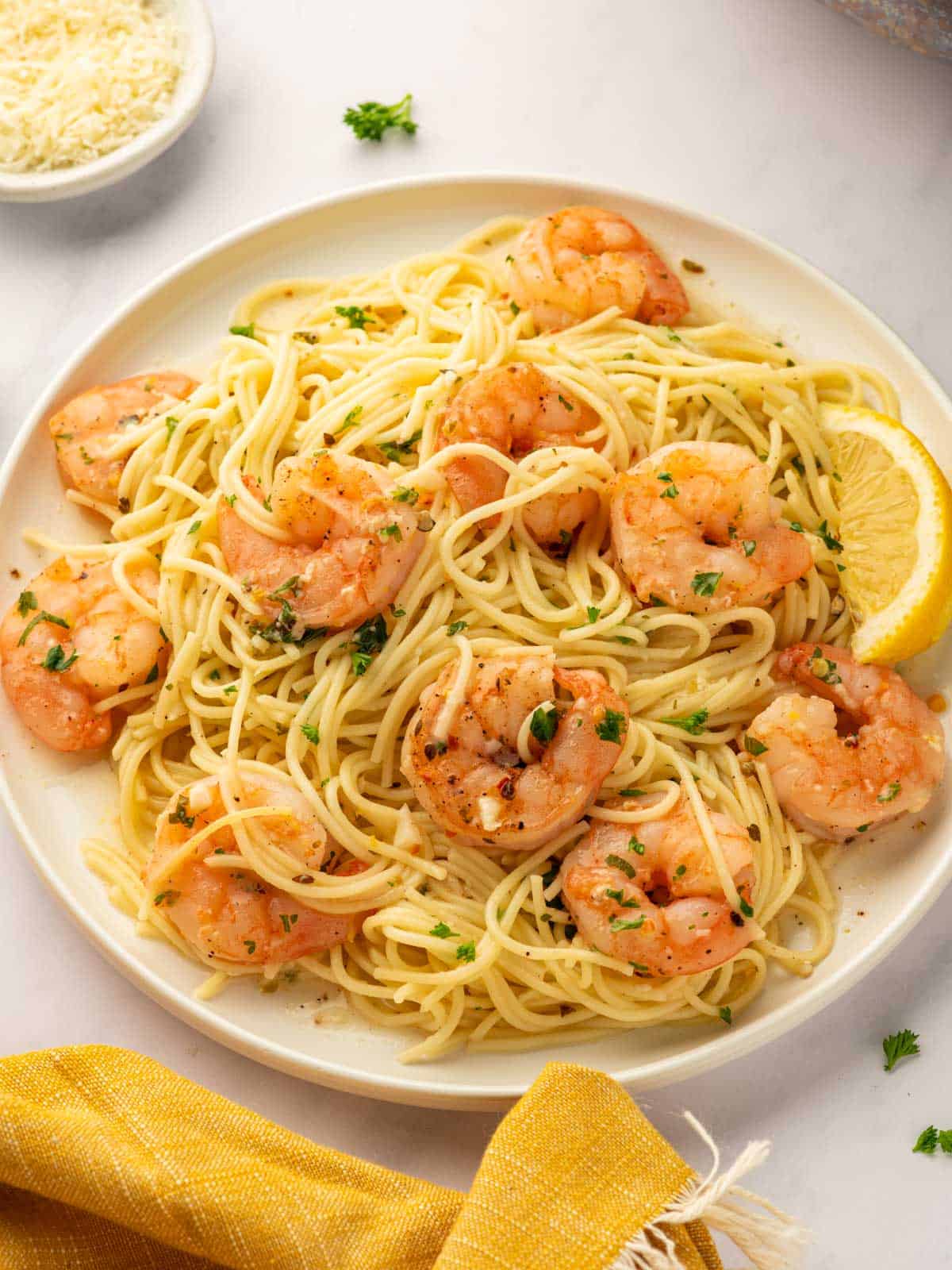 A platter of shrimp scampi pasta.