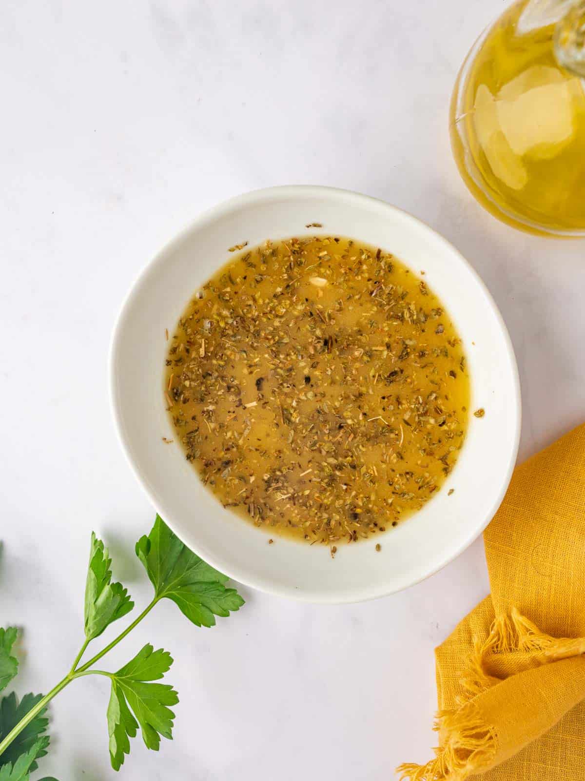 A bowl of vinaigrette for bean salad.