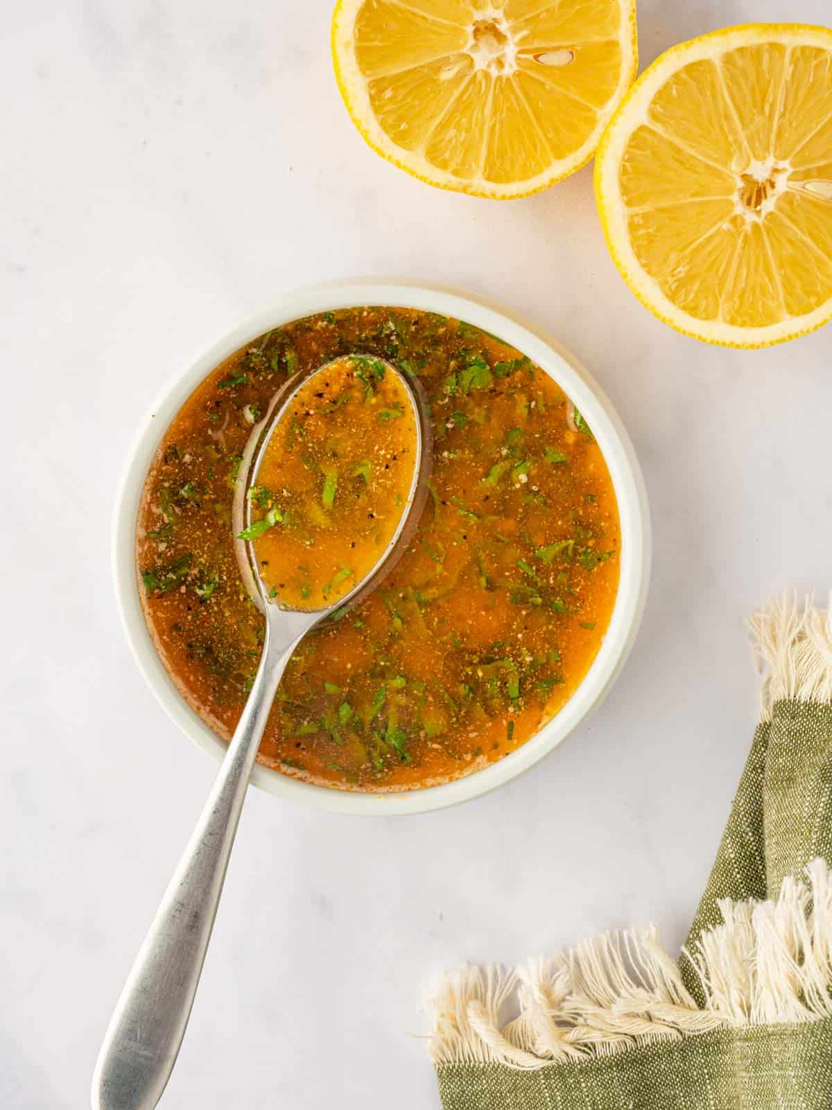 A spoon mixed the marinade ingredients.