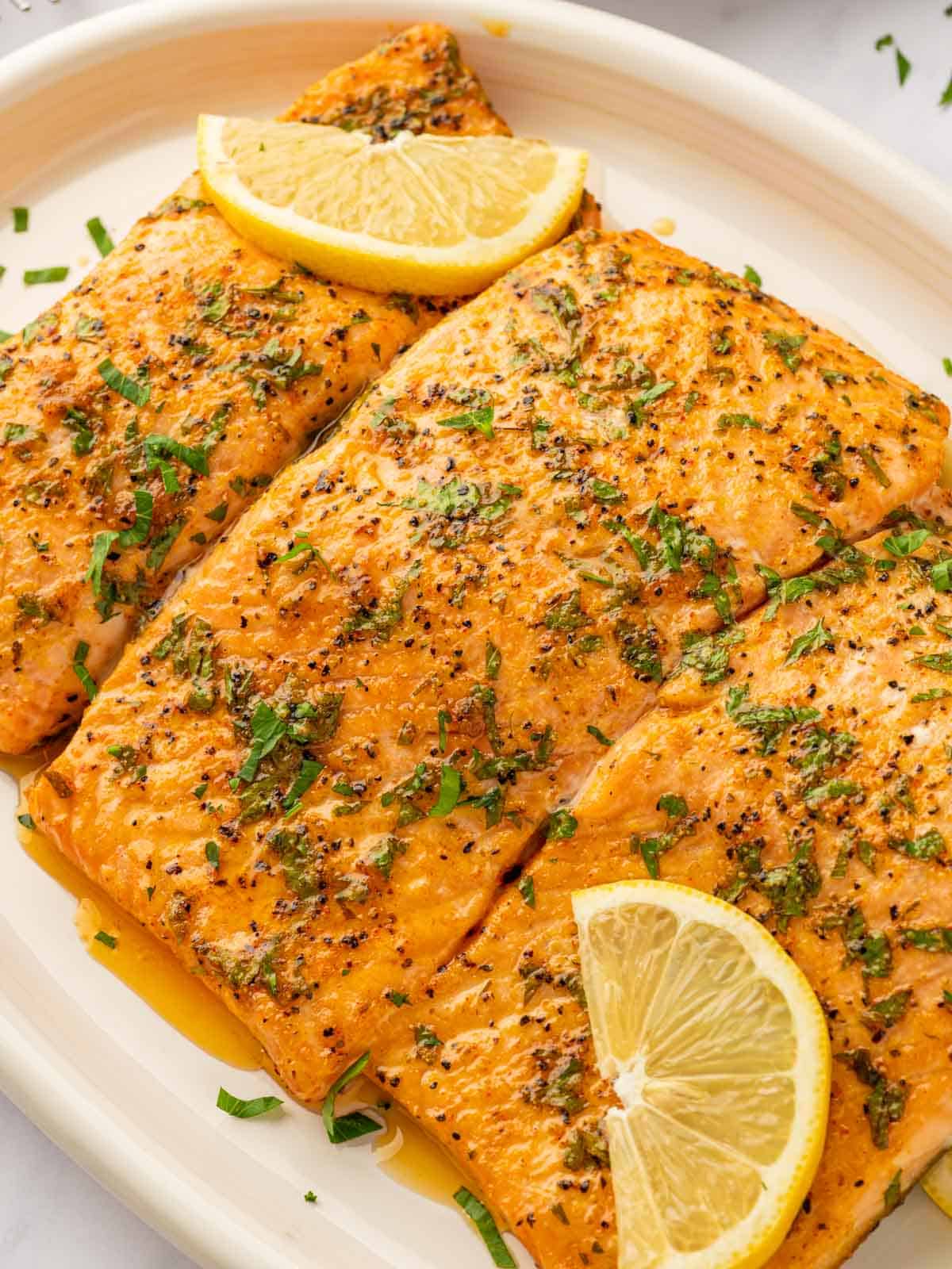 Close up of salmon filets on a tray.