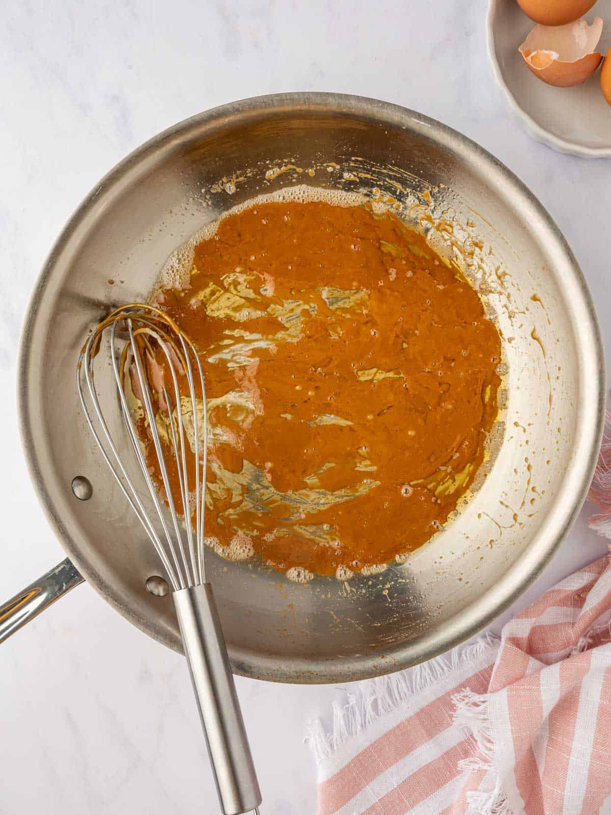 Caramel sauce in a skillet.