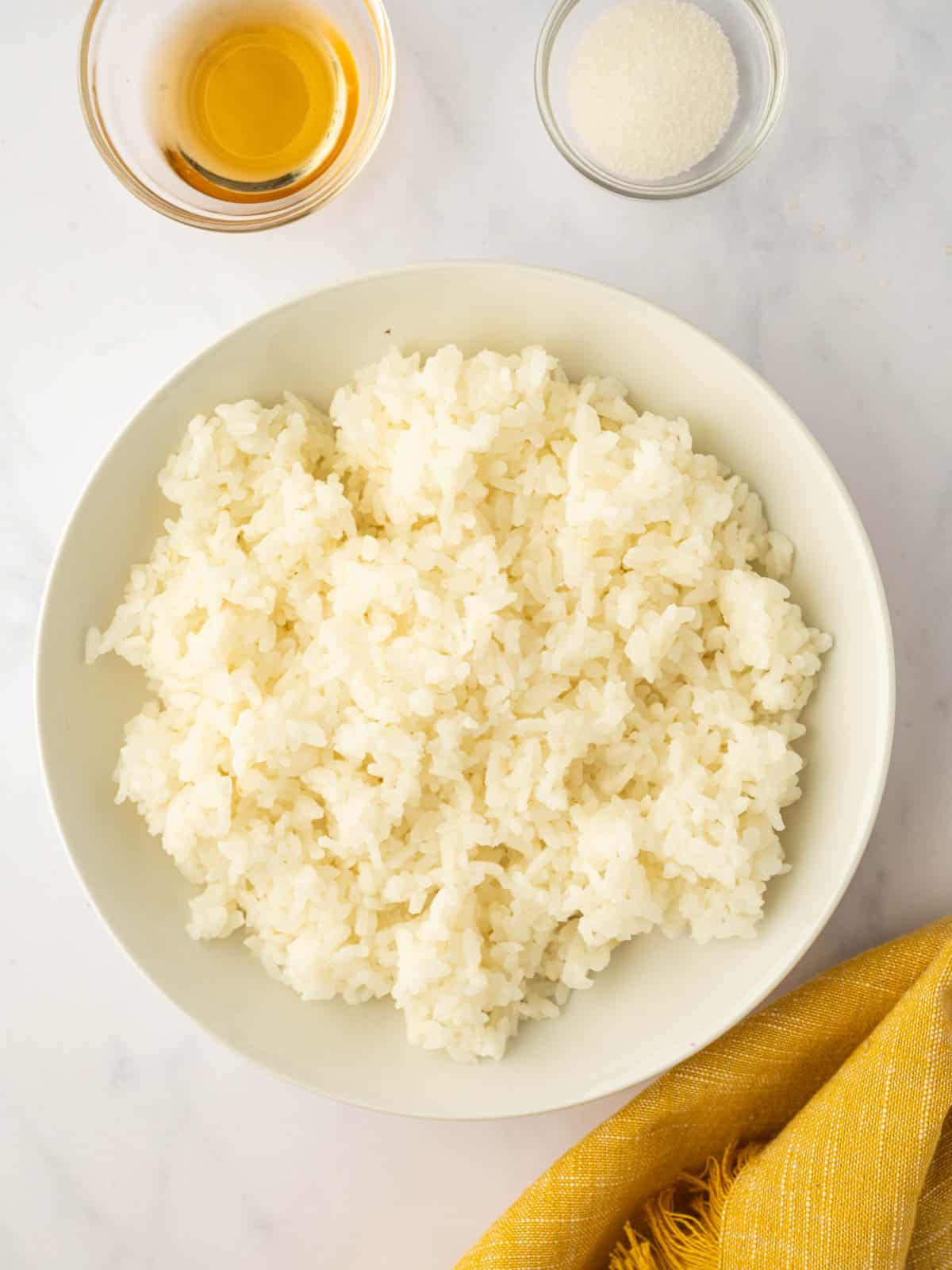 prepared Sushi rice sits in a bowl.