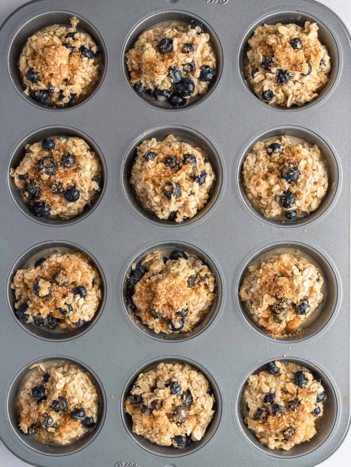 Oatmeal before being baked in a muffin tin.
