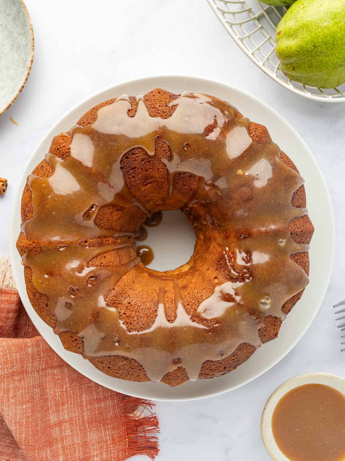 Caramel drizzled over pear bundt cake.