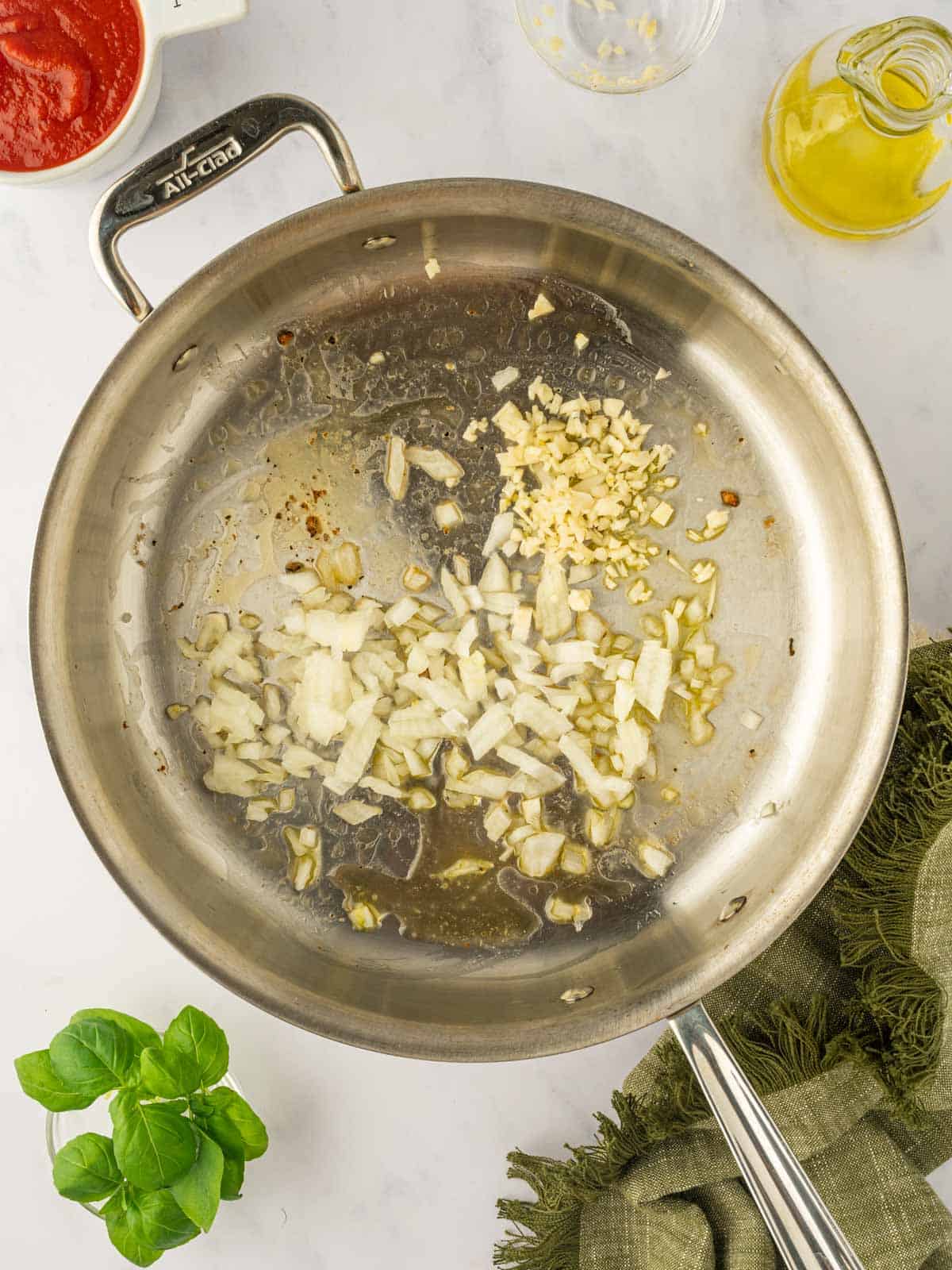 Saute garlic and onions in a skillet.