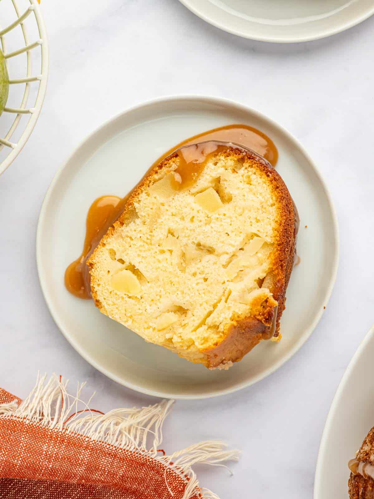 A slice of pear cake on a plate.