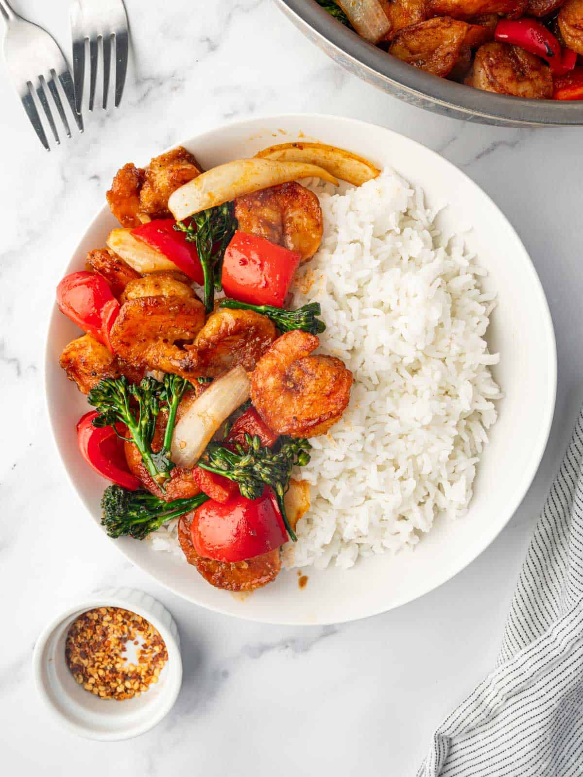 Panda express shrimp on a plate with rice.