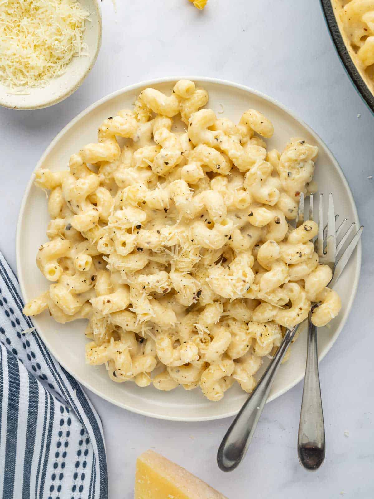 A serving of cheesy pasta on a plate.