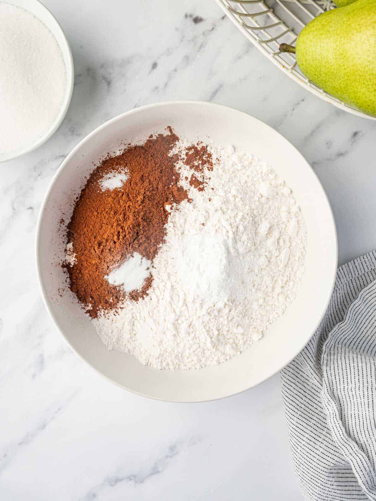 Dry ingredients for making chocolate pear cake.