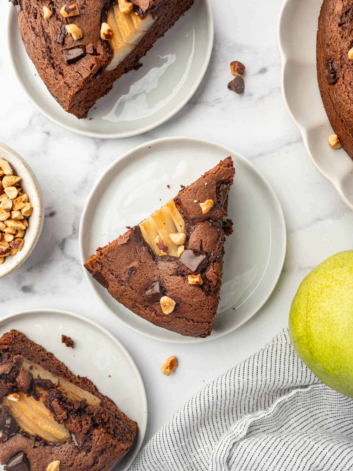 Sliced of pear cake on individual plates.