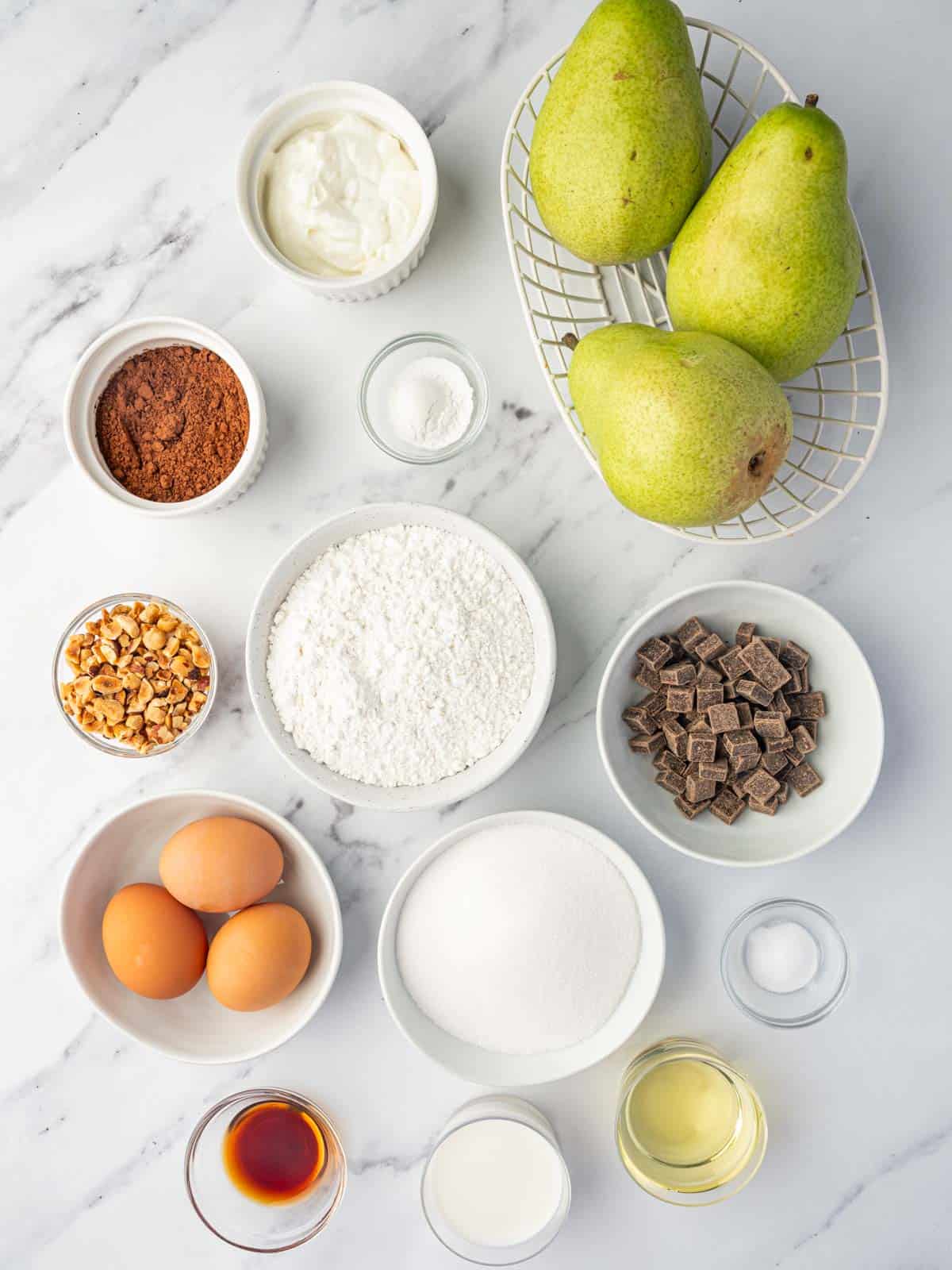 ingredients of chocolate pear cake laid out.