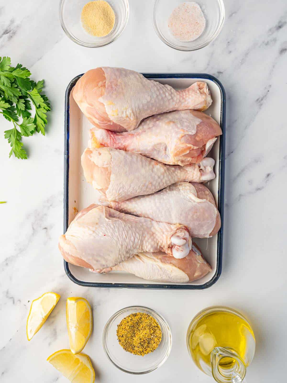 Ingredients needed for baked lemon pepper chicken legs.