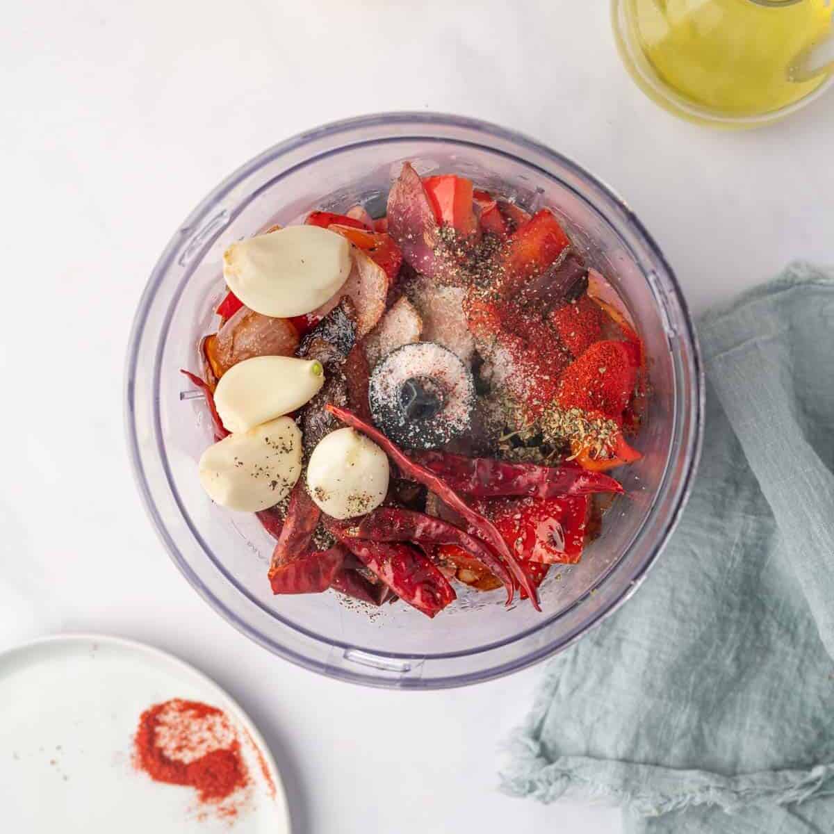 Combine the marinade ingredients in the food processor.