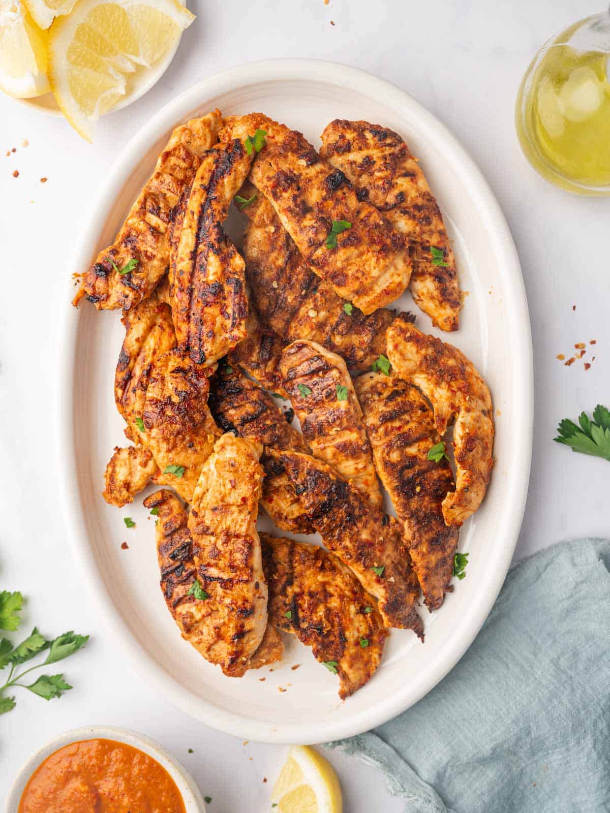 A platter of grilled peri peri chicken tenders.