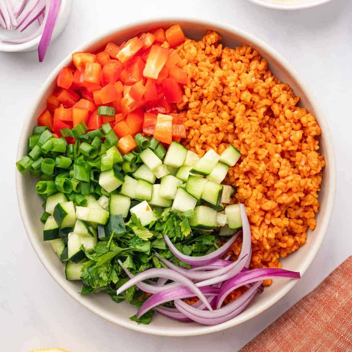 Ingredients of kisir salad in a bowl before mixing.