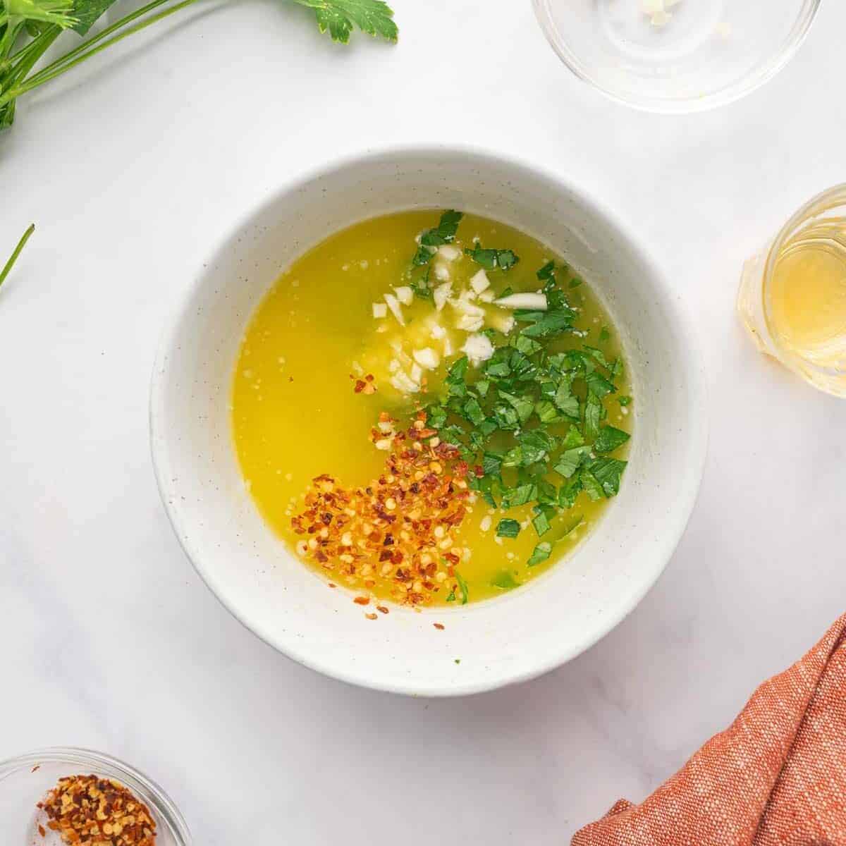 Chicken marinade is prepared in a bowl.