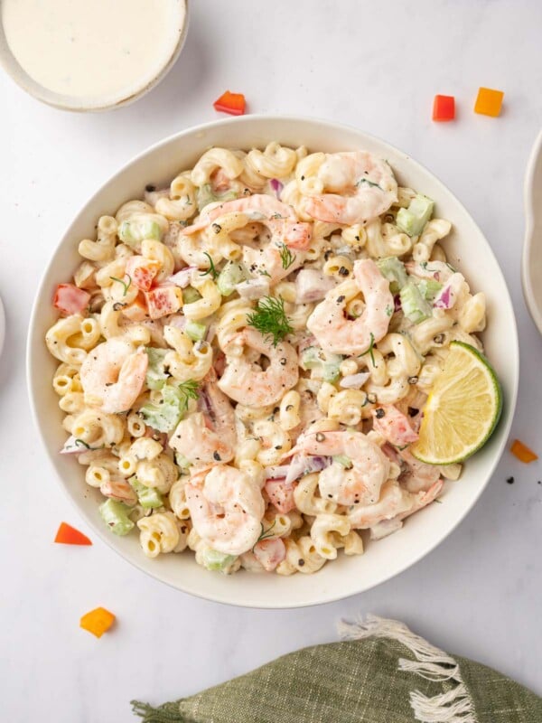 Macaroni salad with shrimp in a bowl.
