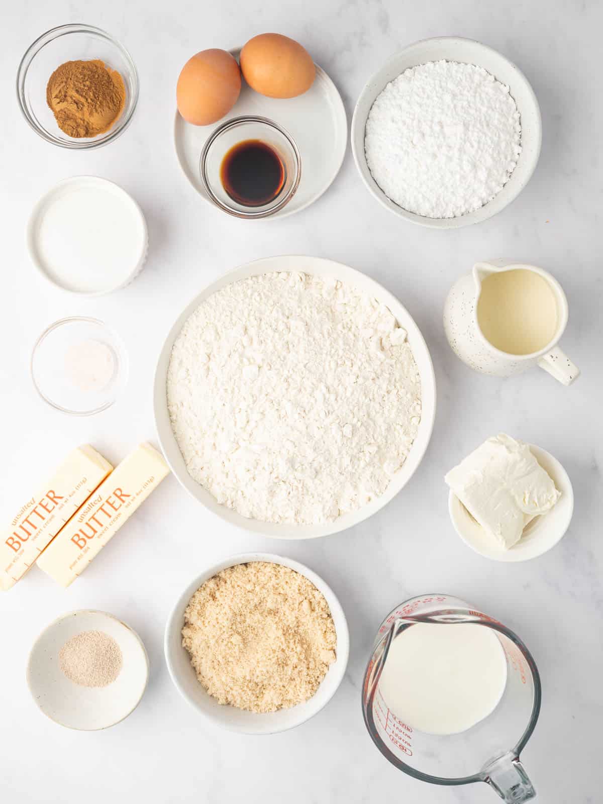 Ingredients needed for cinnamon rolls made with heavy cream.