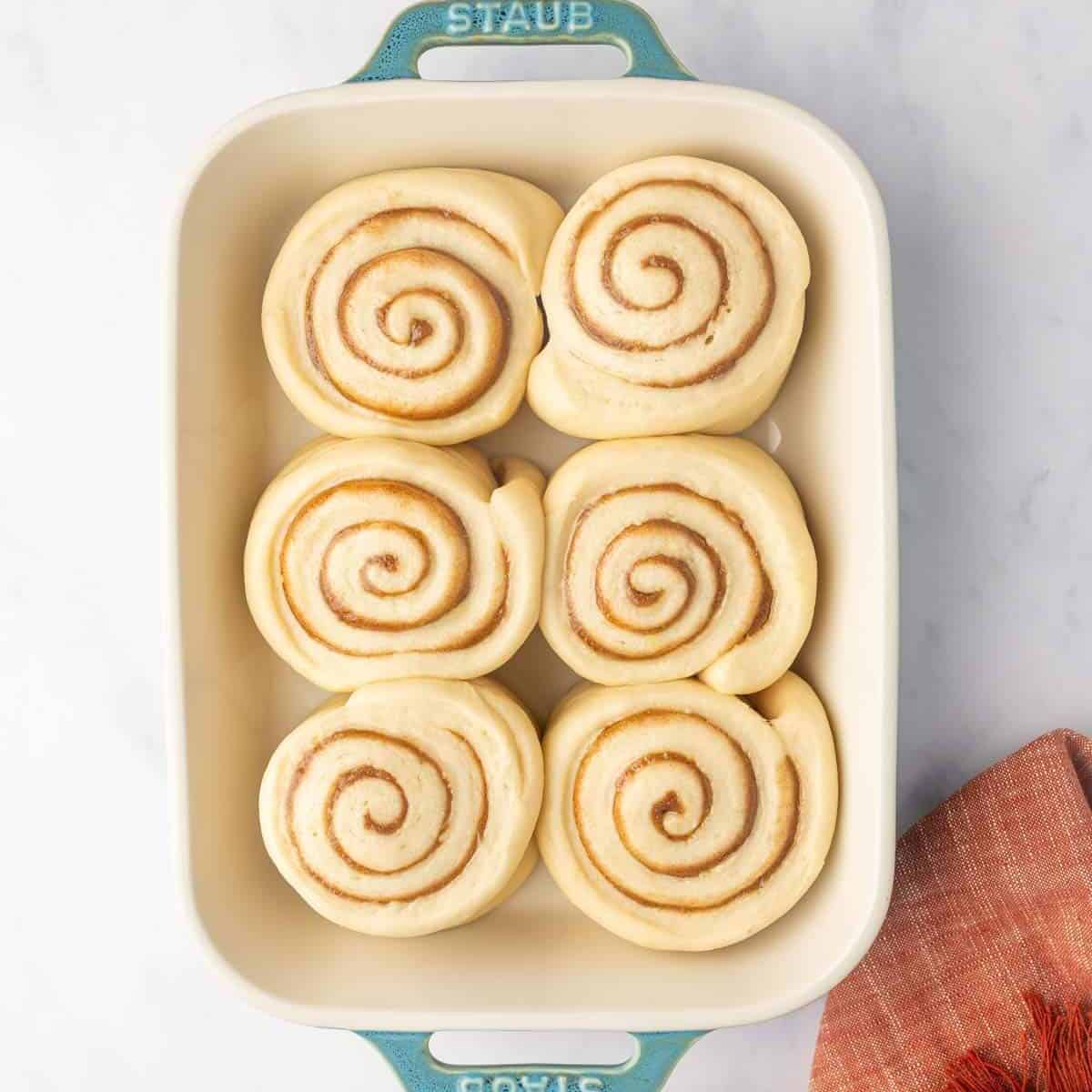 Cut cinnamon rolls rise until doubled in size.