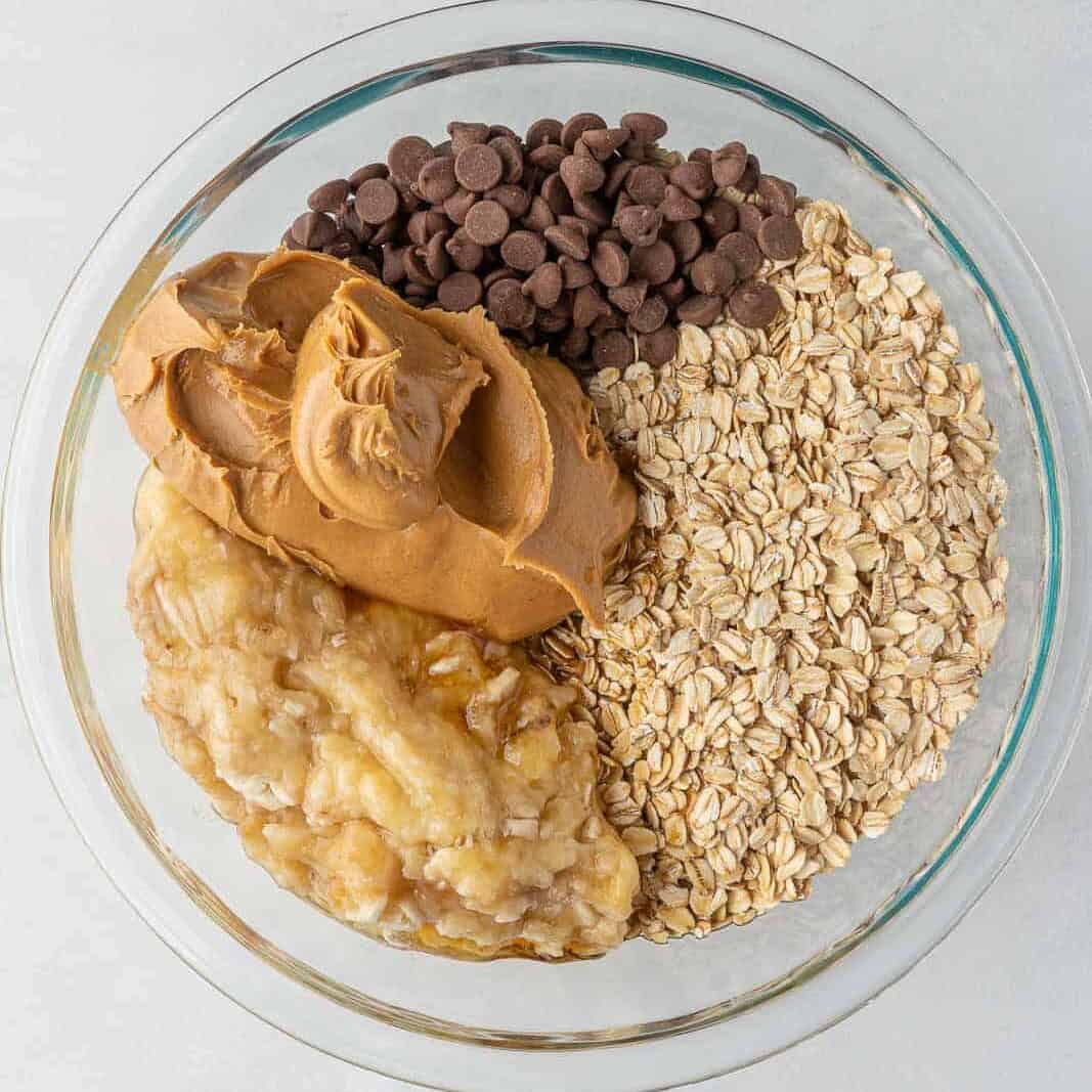 Oatmeal bar ingredients in a clear baking bowl.
