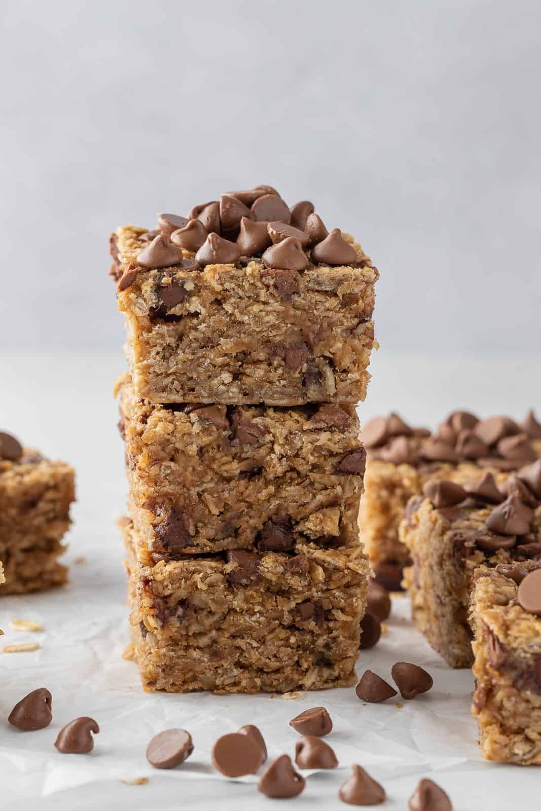 Three chocolate chip peanut butter oatmeal bars in a stack.