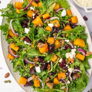 Butternut squash feta salad on a large platter for serving.