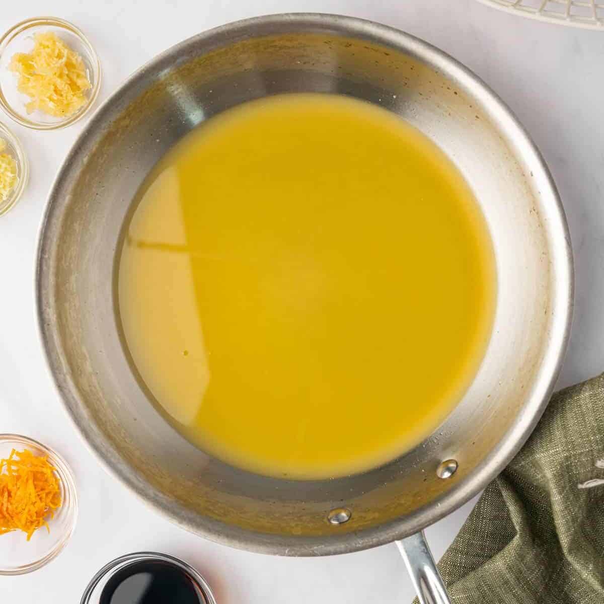 Fresh orange juice in a saucepan before adding the remaining sauce ingredients.