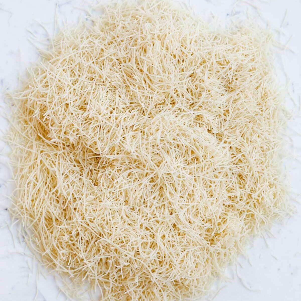 Raw shredded Kataifi dough.