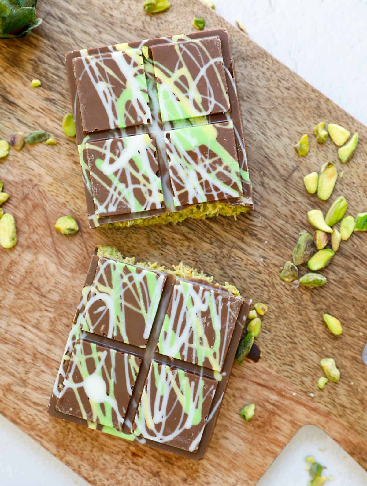 A dubai pistachio chocolate bar cut in half.