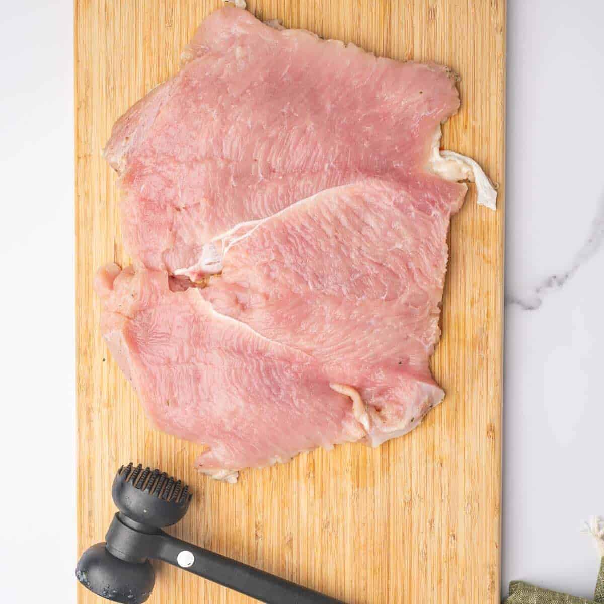Butterflied turkey breast flattened to an even thickness.