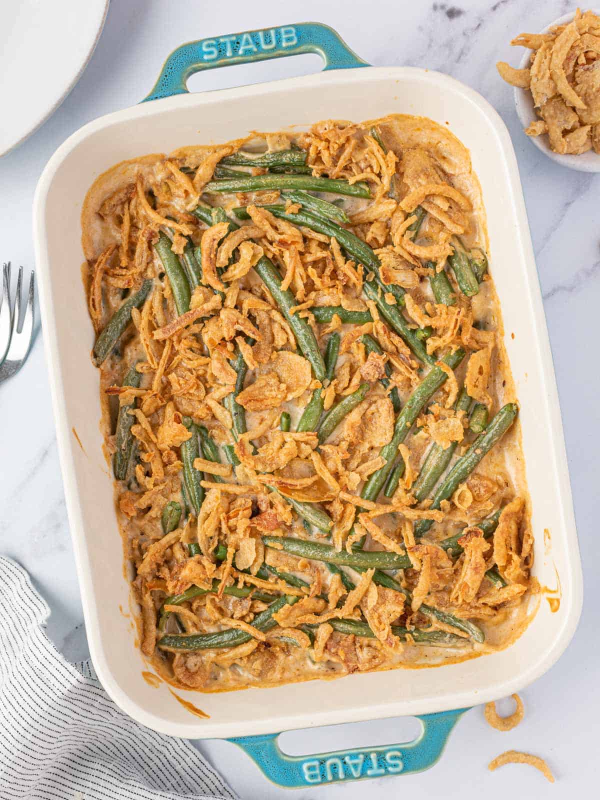 Cheesy green bean bake topped with crispy fried onions.