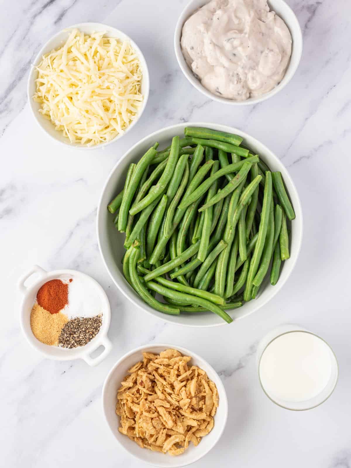 Fresh green beans with cheese, mushroom soup, milk, seasonings and fried onions.
