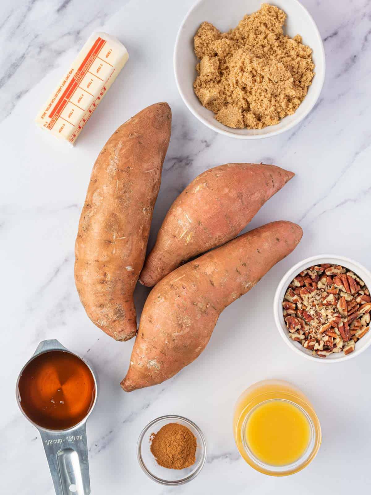 Sweet potatoes with butter, orange juice, maple syrup, brown sugar, cinnamon and chopped pecans.