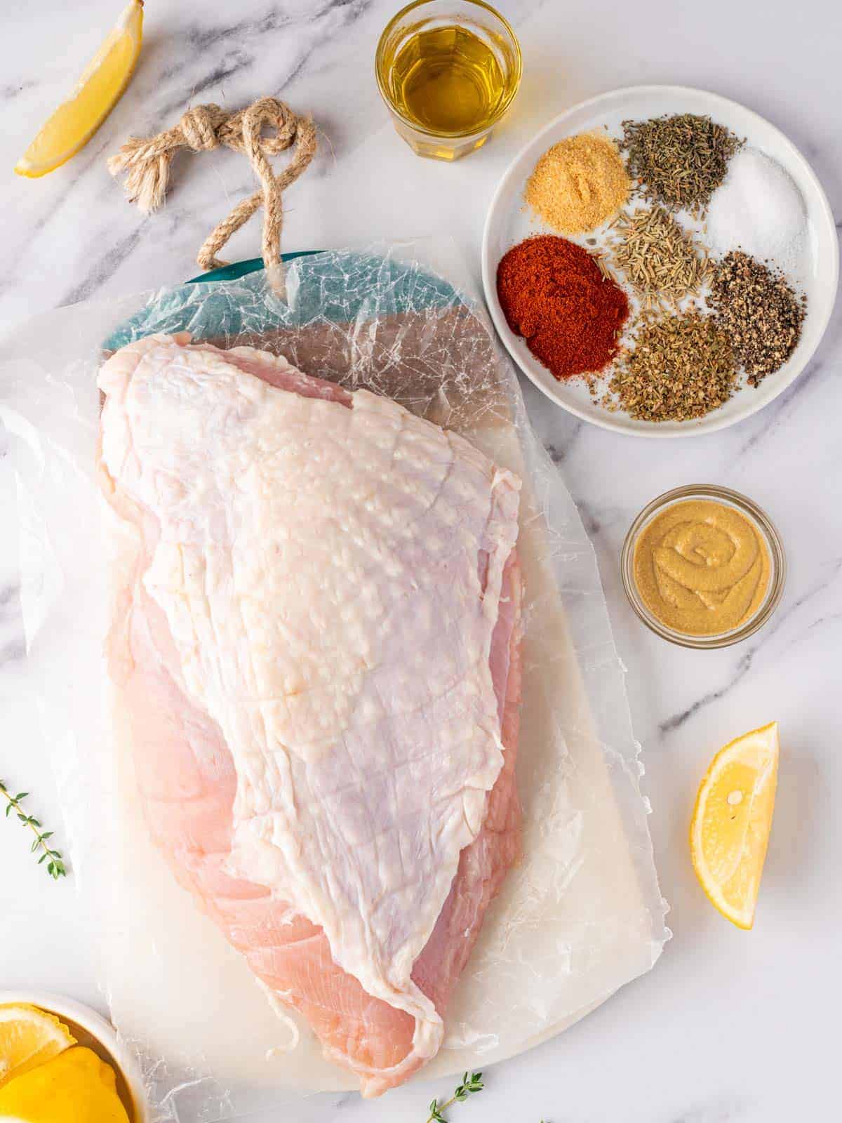 Boneless skin-on turkey breast with Dijon mustard, olive oil, lemon, herbs, and seasonings.