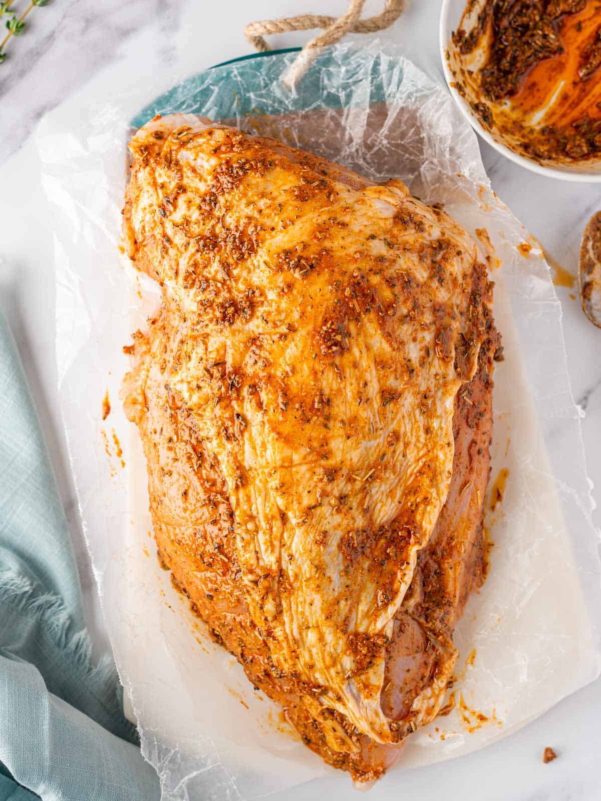 Marinated roasted turkey breat before baking.