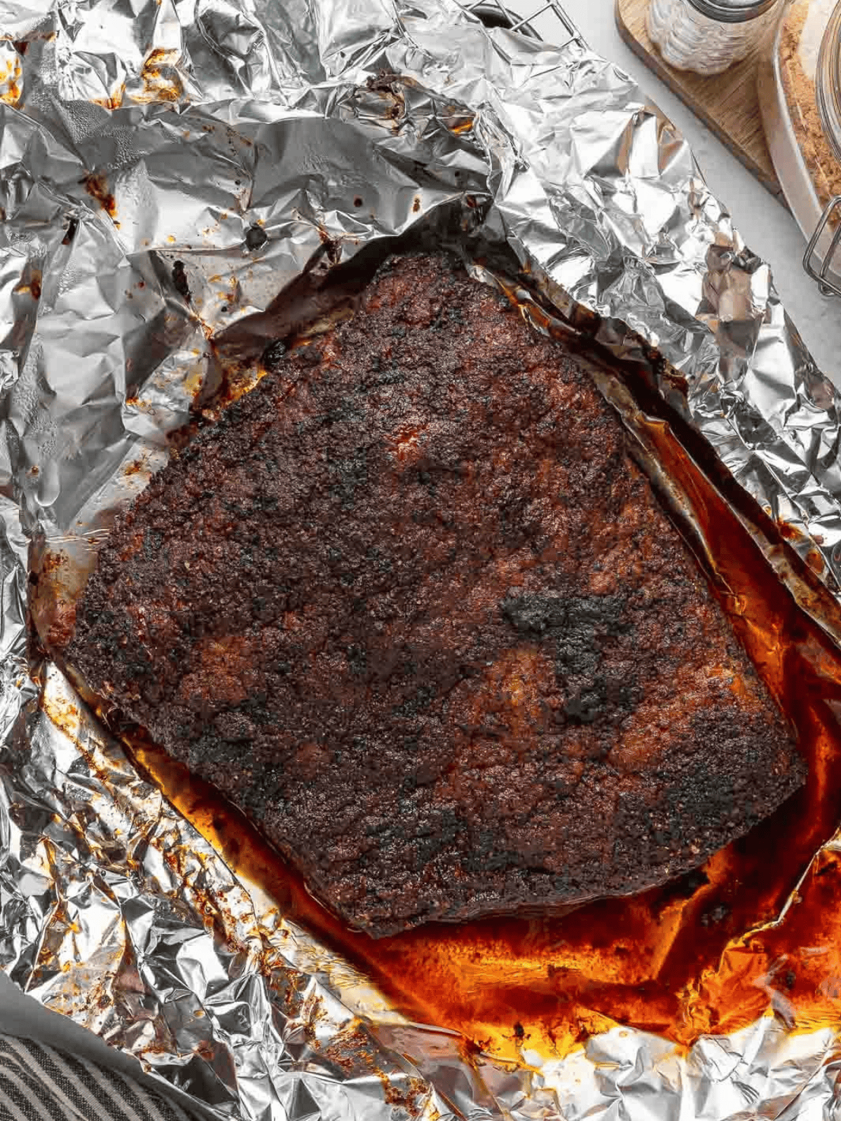Oven Baked Beef Brisket with a dark seasoned crust after cooking.