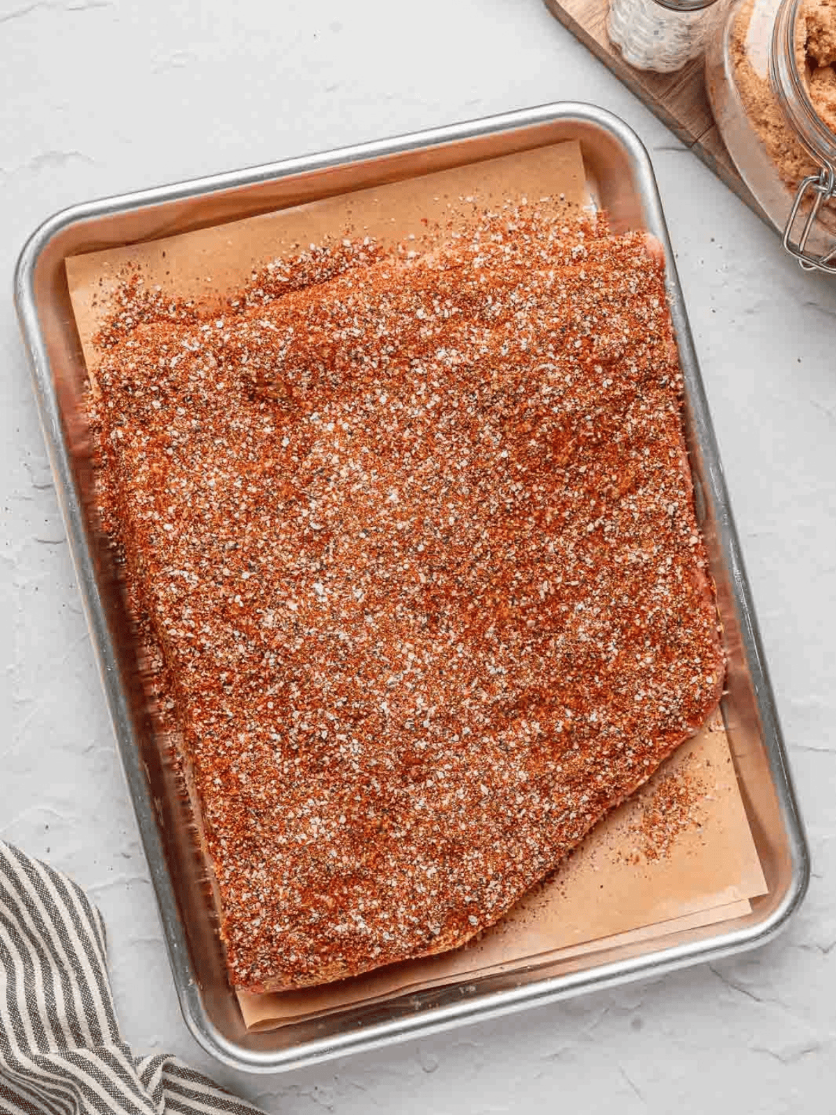 Beef brisket covered evenly with the seasoned dry rub.