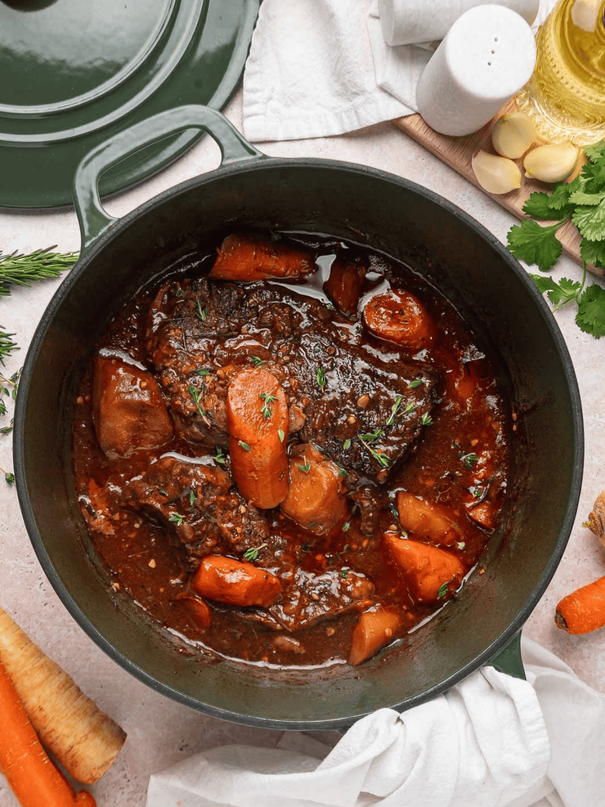 Oven pot roast with tender carrots and parsnips in the Dutch oven.
