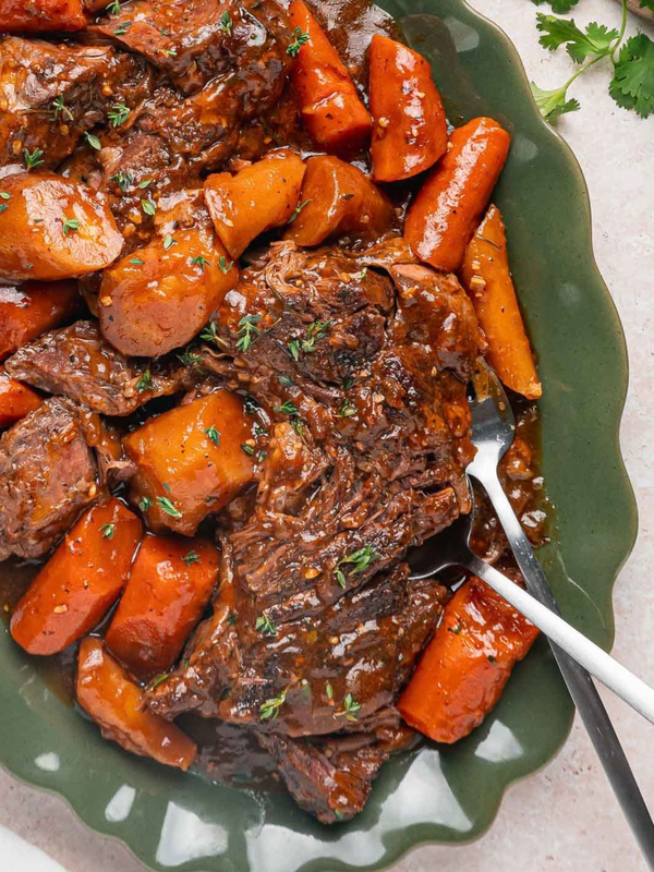 Tender pot roast and root vegetables coated with homemade gravy.